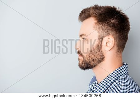 Side View Of Young Bearded Man Isolated On Gray Background