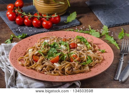 Spaghetti With Mozzarella, Cherry Tomatoes And Arugula