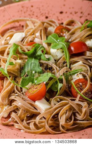 Spaghetti With Mozzarella, Cherry Tomatoes And Arugula