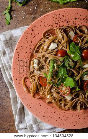 Spaghetti With Mozzarella, Cherry Tomatoes And Arugula