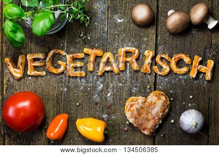 Dough Letters And Vegetables On Rustic Wooden Table, German Word, Vegetarian