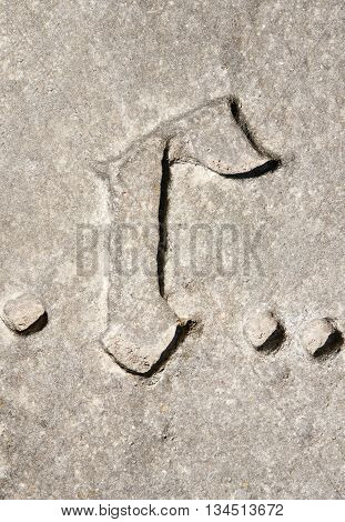 Cyrillic symbol G on granite slab. Ukraine Zolochev Carpathian