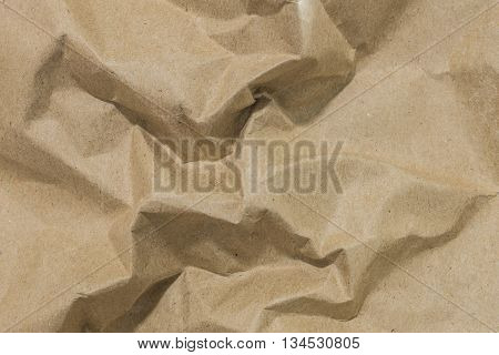 Brown surface of crumpled paper texture background