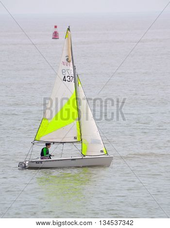 FELIXSTOWE, SUFFOLK, ENGLAND - JUNE 11, 2016: Colourful Sailing Dinghies on the North Sea  at Felixstowe Suffolk England.