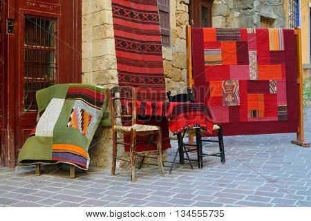CHANIA GREECE - AUGUST 07: Traditional carpets for sale in Chania Greece on August 07 2014. Chania is one of the most popular tourist place on Crete island in Greece.