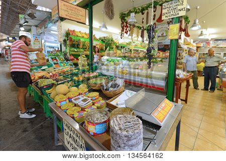 CHANIA GREECE - AUGUST 12: Unknown people sell local food in Chania Crete Greece on 12 August 2014. The cross-shaped market (Agora) of Chania was built in 1911-1913.