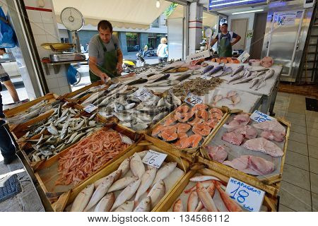 CHANIA GREECE - AUGUST 13: Unknown people sell fresh fish in Chania Crete Greece on 13 August 2014. The cross-shaped market (Agora) of Chania was built in 1911-1913.