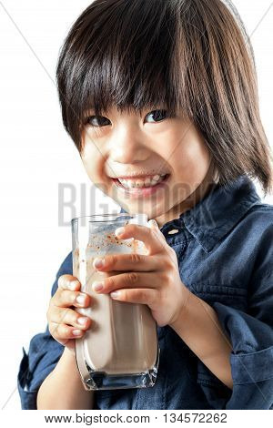 Close up portrait of little Asian boy drinking chocolate milkshake.Isolated on white background.