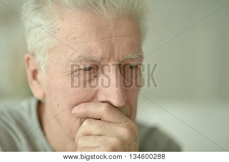 Portrait of Sad senior man at home