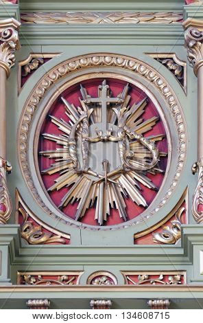 ZAGREB, CROATIA - SEPTEMBER 14: IHS sign on the altar in the Basilica of the Sacred Heart of Jesus in Zagreb, Croatia on September 14, 2015
