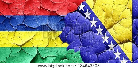 Mauritius flag with Bosnia and Herzegovina flag on a grunge crac