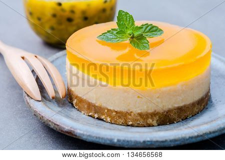 Passion Fruit Cheesecake With Fresh Mint Leaves On Dark Background. Passion Fruit Cheesecake Setup W