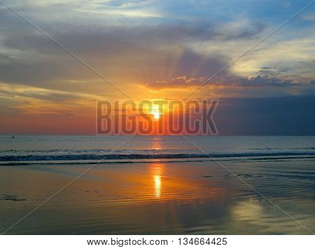 Beautiful sunset sky with reflection at Kuta and Seminyak beach, Bali
