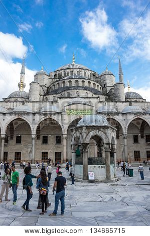 ISTANBUL TURKEY - JUNE 19 2015: People visiting Sultan Ahmet Mosque (Turkish: Sultan Ahmet Camii) a historic mosque in Istanbul Turkey. The mosque is popularly known as the Blue Mosque for the blue tiles adorning the walls of its interior