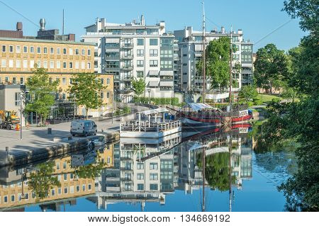 LINKOPING, SWEDEN - JUNE 3, 2016: Summer morning by river Stangan in Linkoping. Linkoping is a famous University town in Sweden.