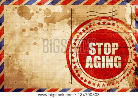 stop aging, red grunge stamp on an airmail background