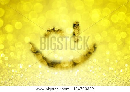 Abstract yellow emoji smiley face wink emoticon bokeh background
