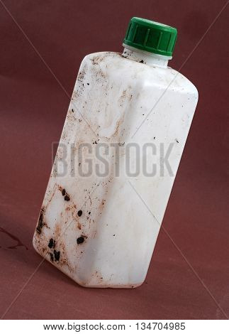 picture of a Dirty Bottle of chemical liquid
