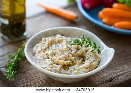 cannellini beans dip with baby carrotcelery and radish