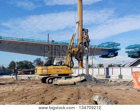 MALACCA, MALAYSIA - MARCH 12, 2015: Bore pile rig machine at the construction site in Malacca, Malaysia. The machine used to driven pile for building foundation work.
