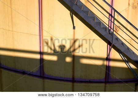 People Shadows On Old Metal Tanks In Power Plant,