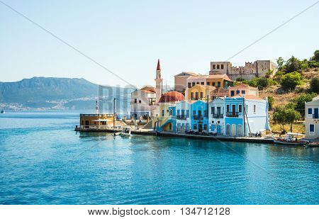View over the houses and mosque on Greek islands Kastelorizo and the sea from the bay