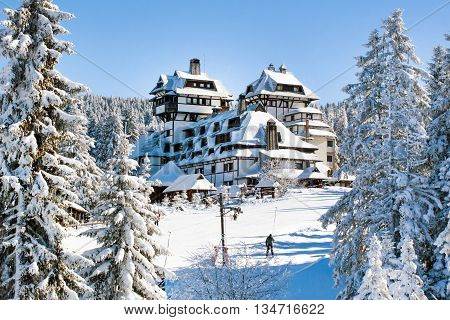 Panorama of ski resort Kopaonik, Serbia, people houses covered with snow