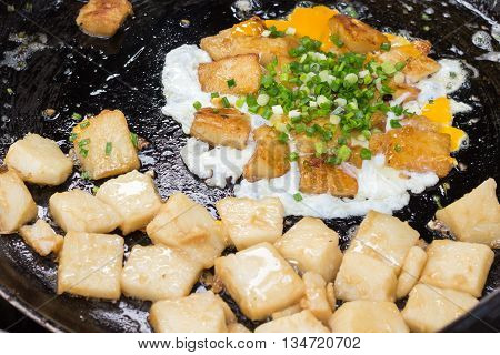 'Bot Chien' Fried rice flour cake with eggs, Vietnamese street food in Ho Chi Minh city.