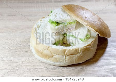 Sandwich Box With Chicken Burger, Tomatoes, Ham, Tuna, Cheese On Wood Table.