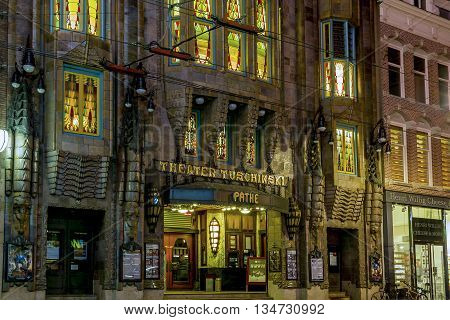 AMSTERDAM, NETHERLANDS - MAY 5, 2013: It's a night view of a building Theater Tuschinski presenting an eclectic mix of different styles.