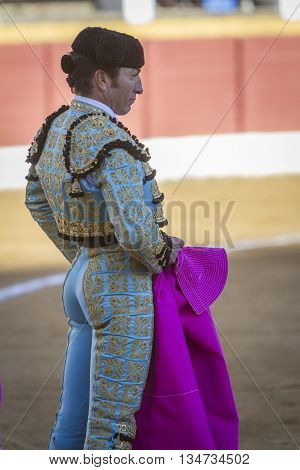Andujar Spain - September 10 2010: The Spanish Bullfighter El Fundi bullfighting with the crutch in the Bullring of Andujar Spa