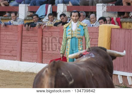 Andujar Spain - September 10 2011: The Spanish Bullfighter Juan de Felix bullfighting with the crutch in the Bullring of Andujar Spain