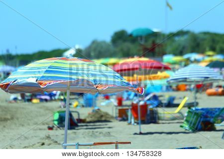 Beach Near The Sea. Sun Umbrellas And Sun Beds For Relaxation