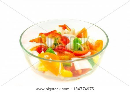 split tomatoes onion and sweet papper in bowl