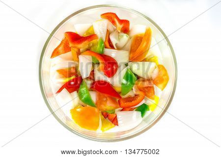 split tomatoes, onion, sweet, sweet papper in bowl
