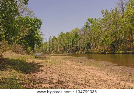 Burburi river at Low Water in by Kanha National Park in India