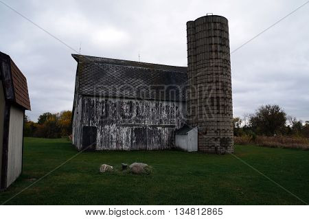 An abandoned 19th century barn and silo stand in the Plainfield Park District's Eaton Preserve in Plainfield, Illinois.