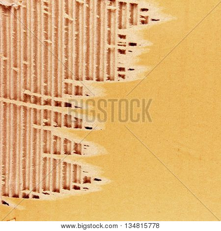 The brown corrugated cardboard sheet background or texture