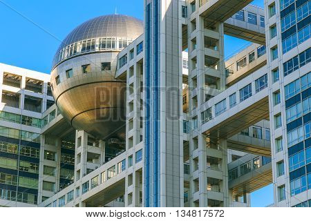 TOKYO JAPAN - NOVEMBER 27 2015: Fuji T.V. headquarters one of the most striking buildings in Japan. its' futuristic metallic clad building featuring a massive silver ball 32 metres in diameter