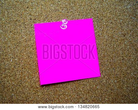 Pink color post  note on wooden board