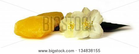 frozen fruit lemon juice frozen ice cubes isolated on white background. Feminine beauty and cosmetics concept Jasmine branch