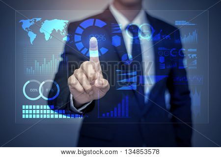 Businessman in suit working with digital virtual screen