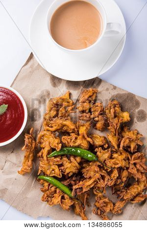 Samosa snack with tomato ketchup and hot tea, Fresh samosas with ketchup and hot chai ready for breakfast