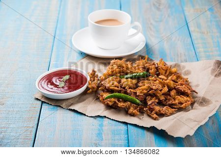 Samosa snack with tomato ketchup and hot tea, Fresh samosas with ketchup and hot chai ready for breakfast