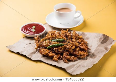 Samosa snack with tomato ketchup and hot tea, Fresh samosas with ketchup and hot chai ready for breakfast