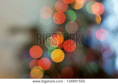 Abstract color bokeh light on defocused background.