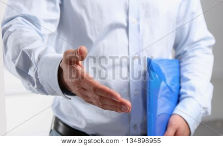 Business man offering his hand for handshake.