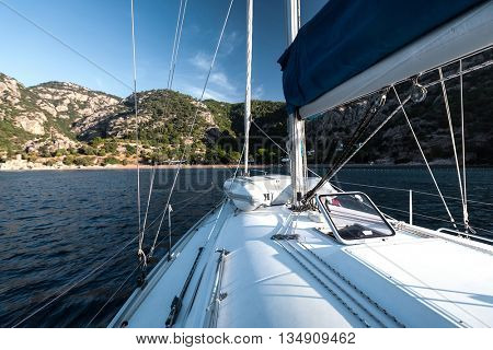 Calm bay with anchored sail boats. Turkey