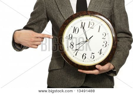 Geschäftsfrau, die Uhr in Händen halten