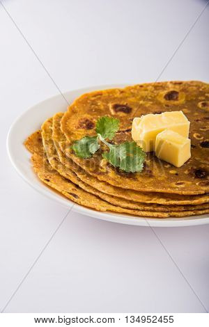 Hot delicious paratha with ghee and tomato sauce